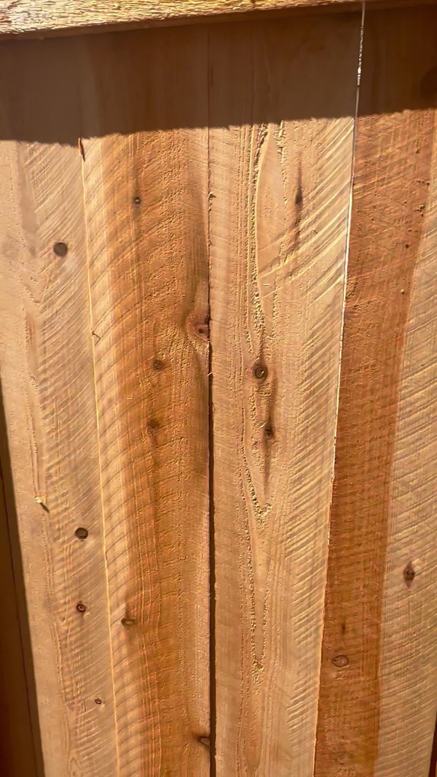 Close-up of clean, tight redwood fence boards